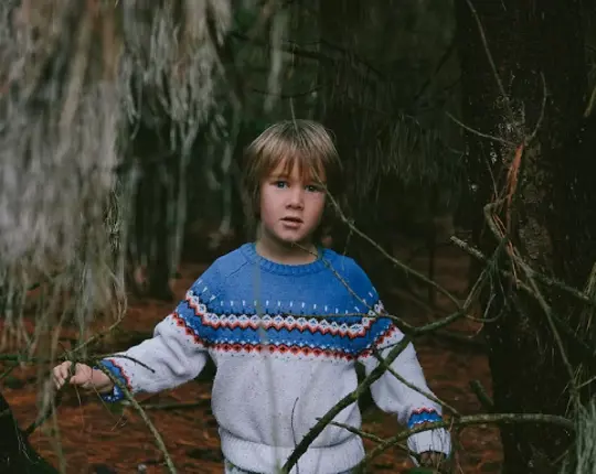 Boy In Woods